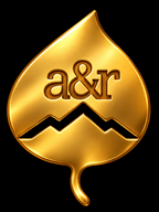 Gold aspen leaf with a&r initials and a mountain ridge