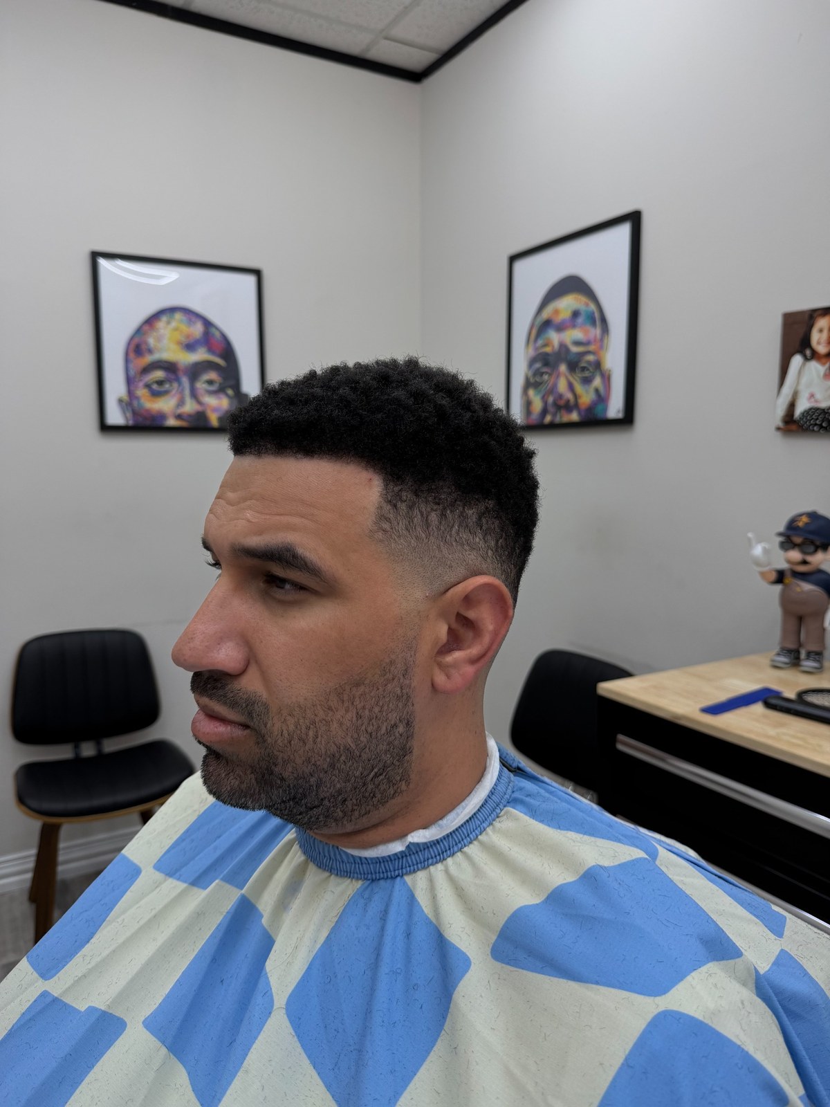 Short textured haircut with a fade and trimmed beard