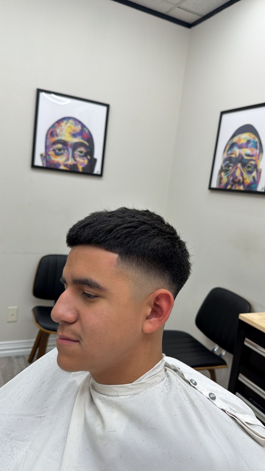 Short haircut with a close fade, viewed from the side