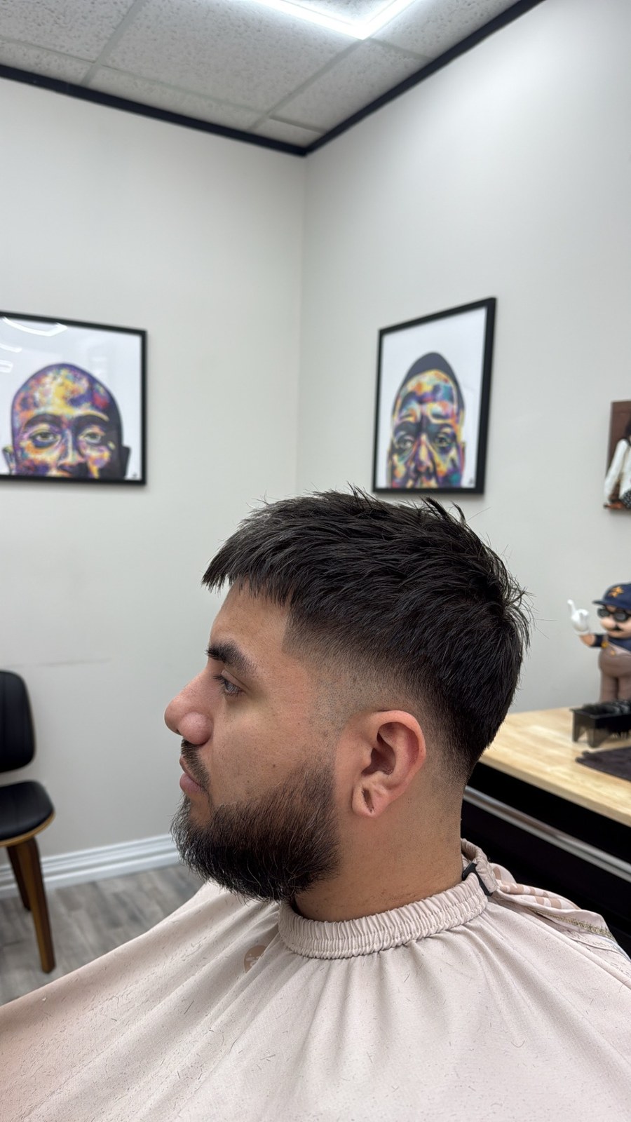 Textured haircut and beard with a close side fade