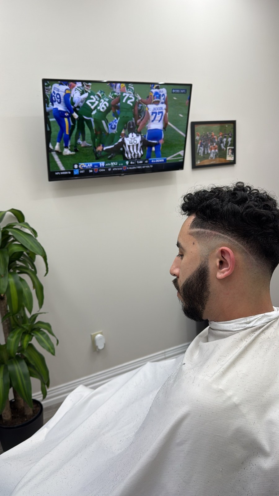 Close side fade and shaped beard, viewed in profile